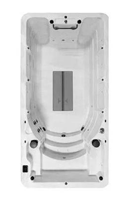 Top-down view of a rectangular, white swim spa with built-in steps and jets.