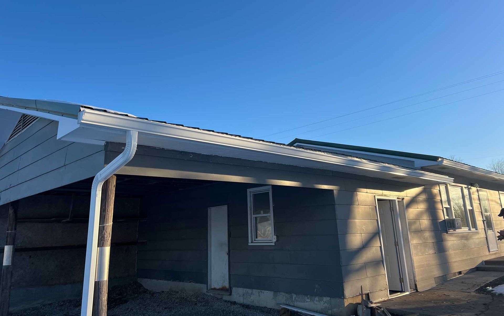 House exterior with downspout