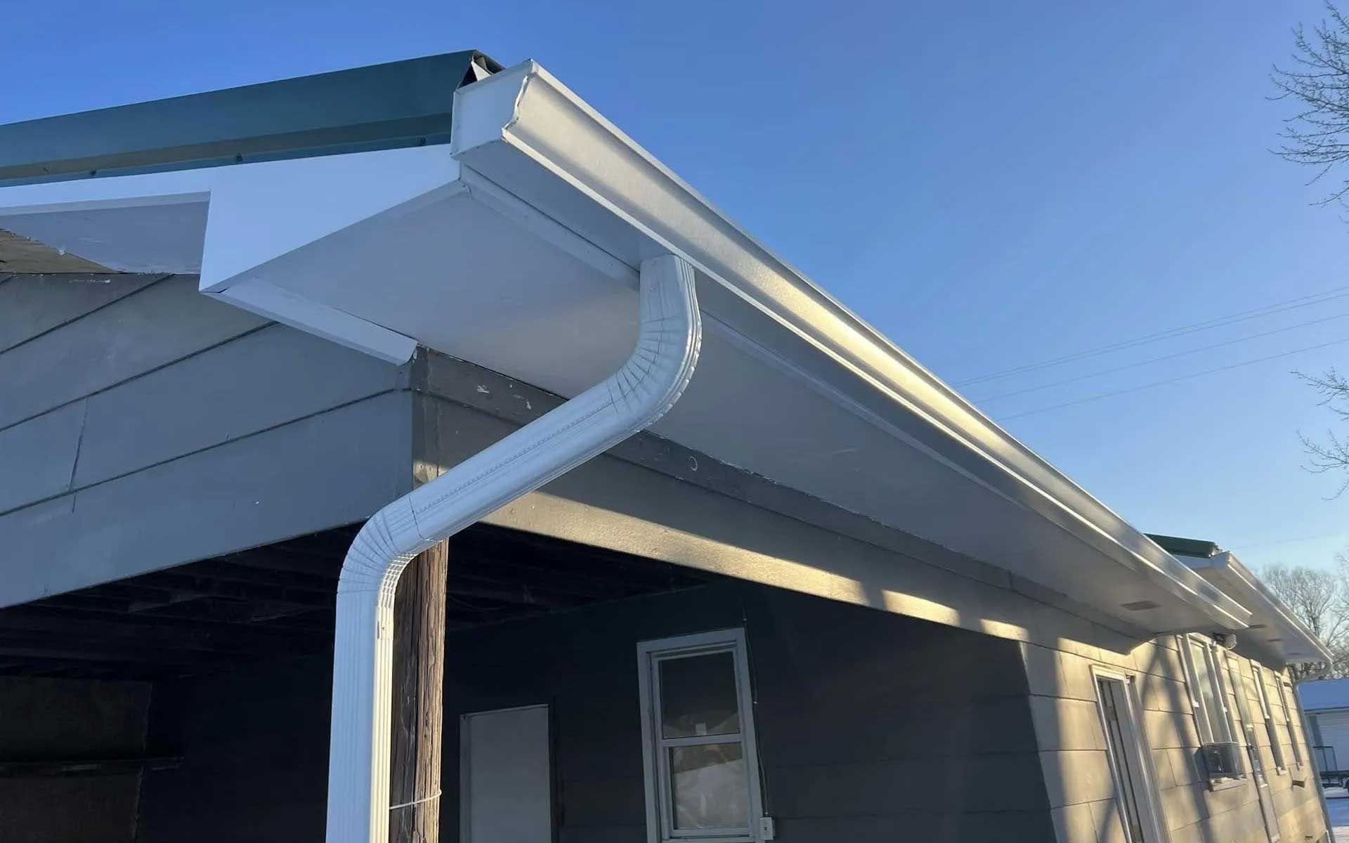 White gutter and downspout on a house