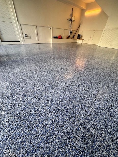 Blue speckled epoxy garage floor.