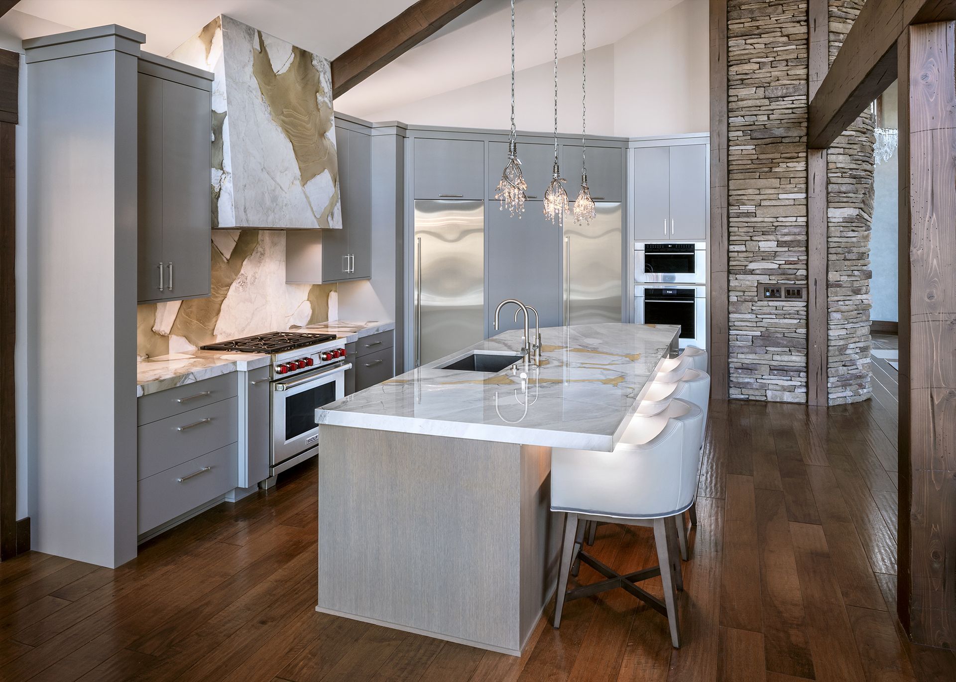 A kitchen with a large island in the middle of it.