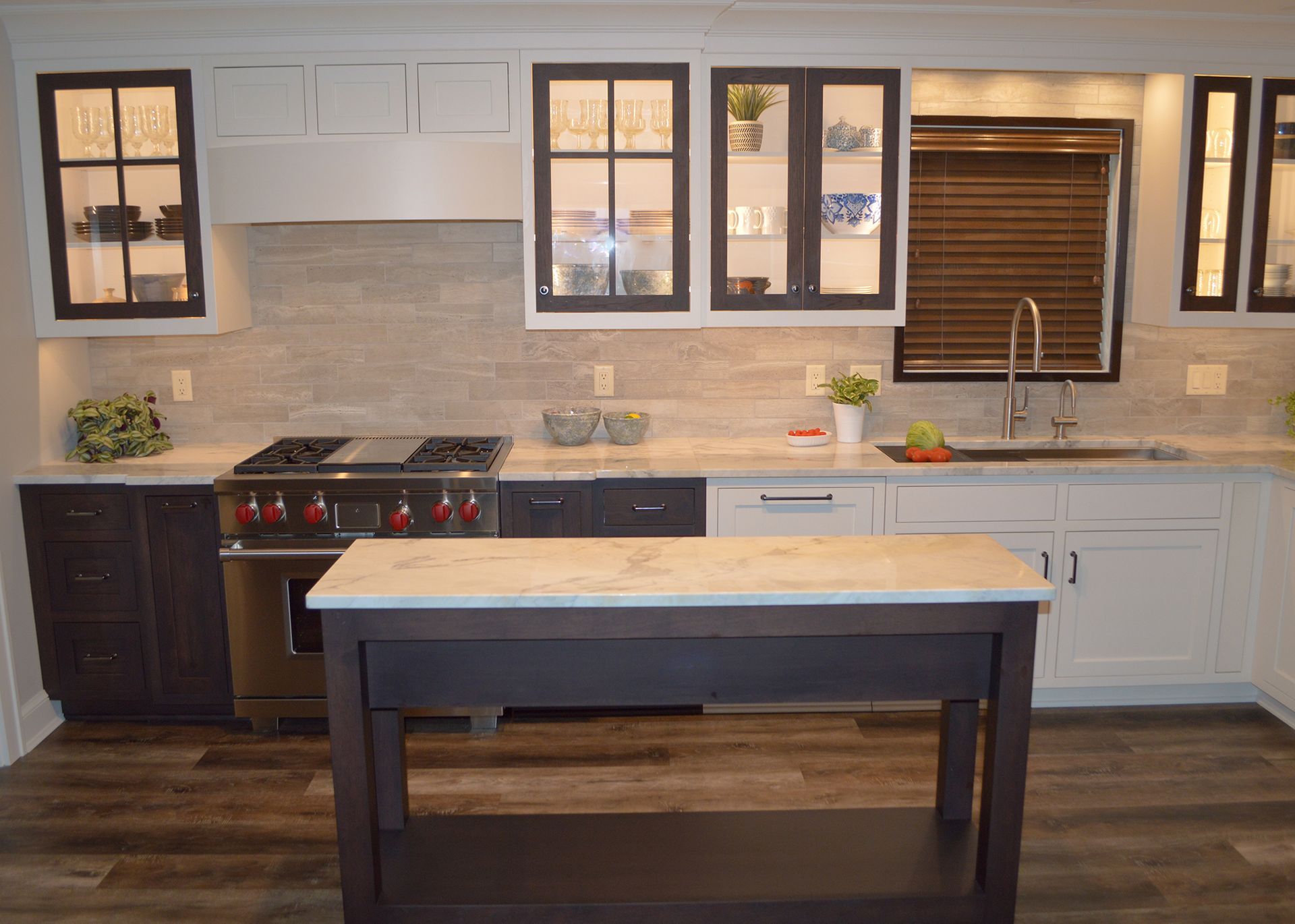 A kitchen with a large island in the middle of it.