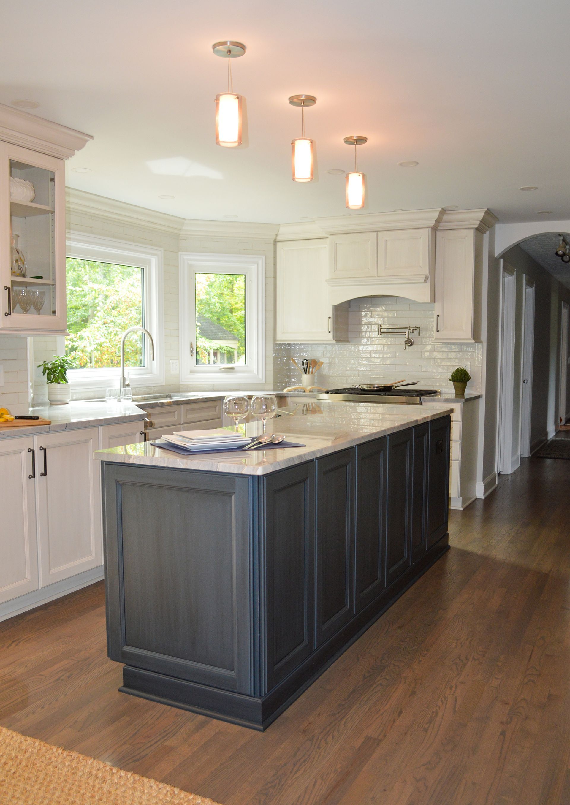 There is a large island in the middle of the kitchen.