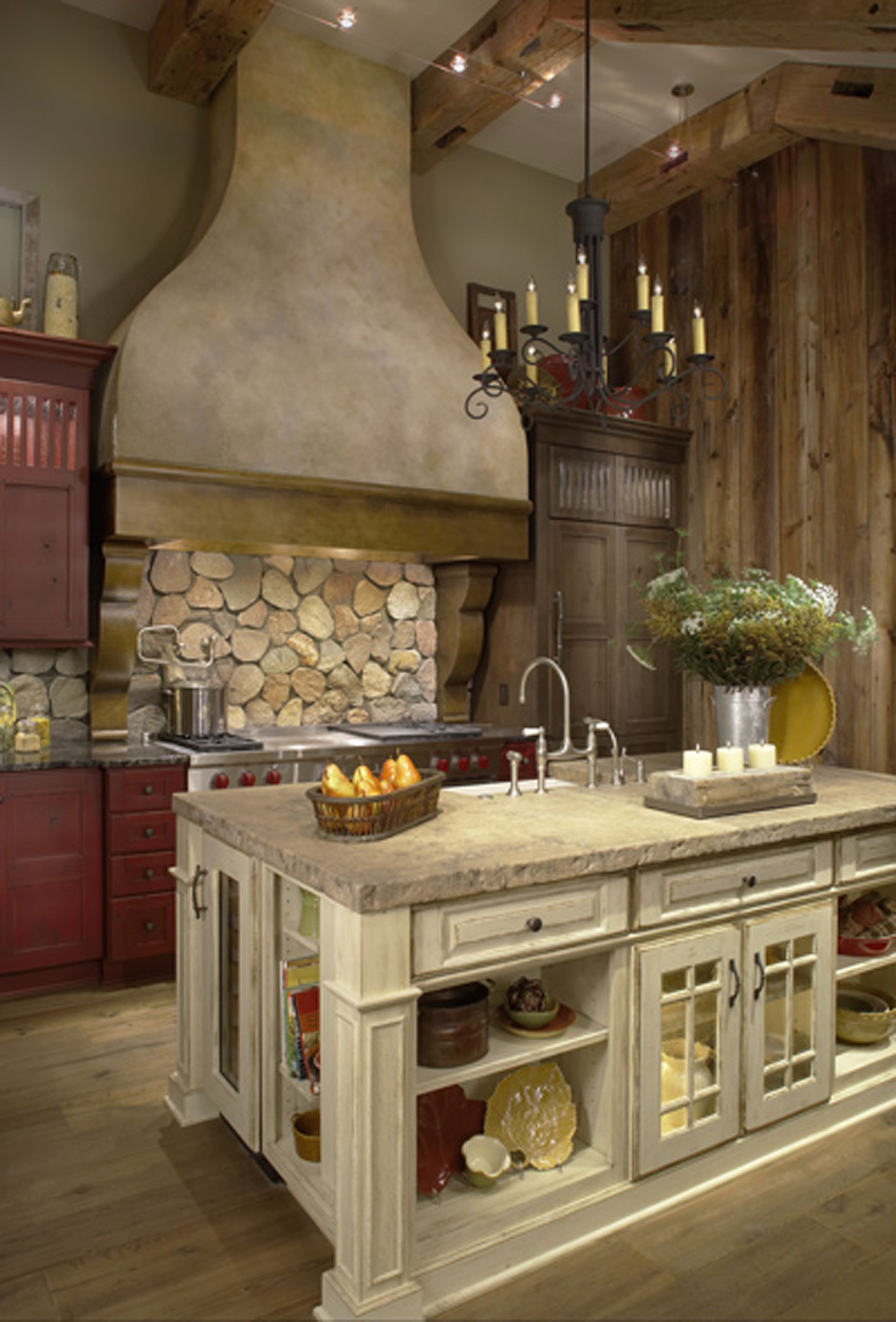 A kitchen with a large island and a stove top oven.