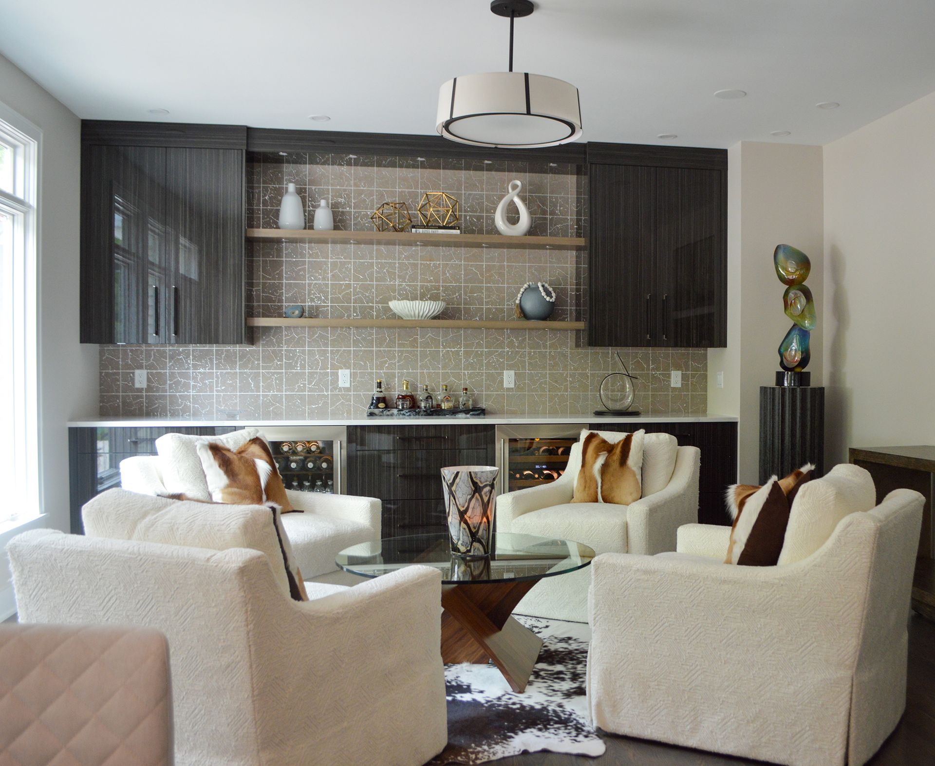 A living room with a couch and two chairs