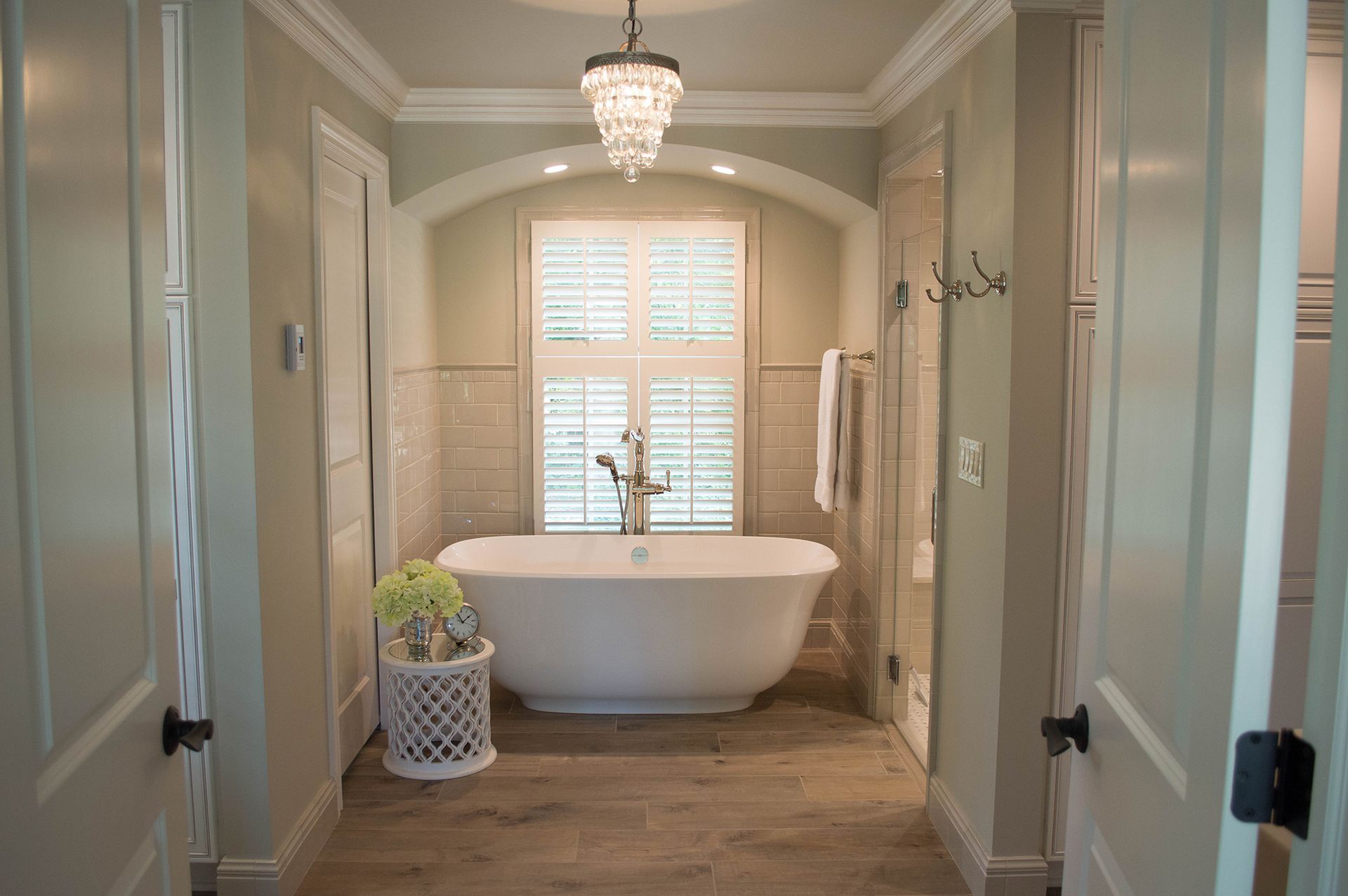There is a bathtub in the middle of the bathroom.