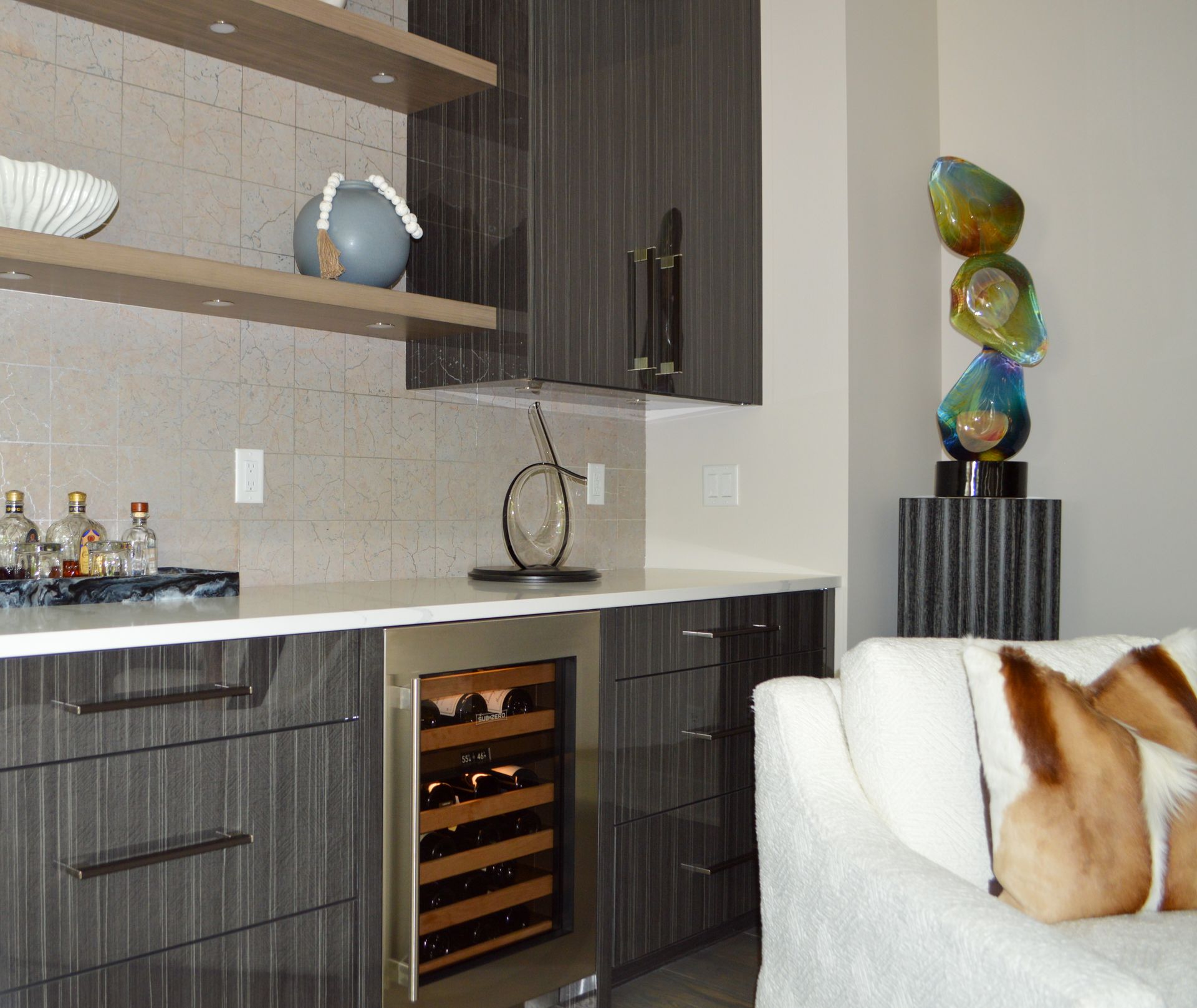 A living room with a couch and a wine cooler