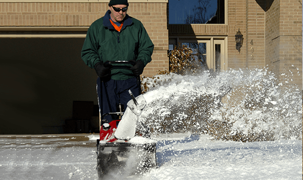 A professional clearing snow.