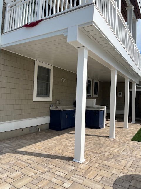 A house with a balcony and a patio under deck