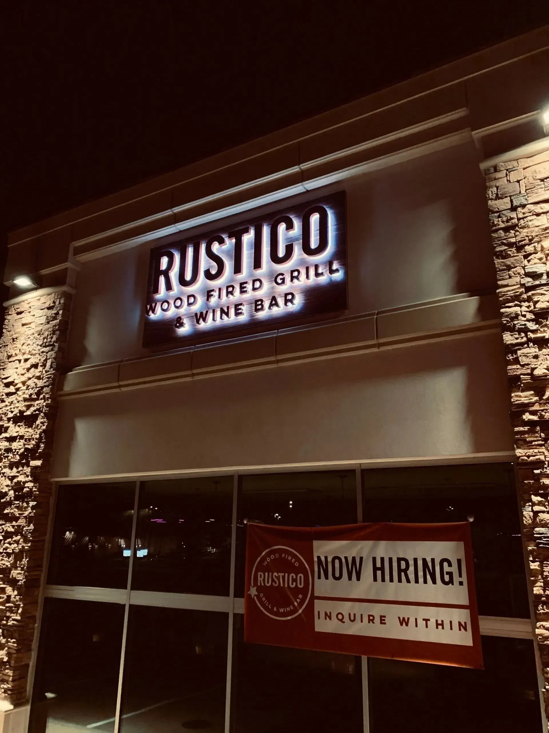 Reverse lit channel letter building sign on sign backer installed at Rustico Gill & Wine Bar in Flower Mound, TX
