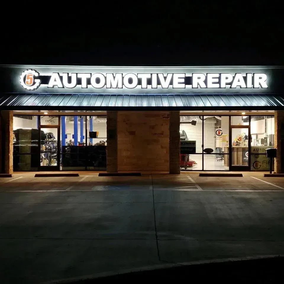 Illuminated front lit channel letter building sign on shape cut backer with halo lighting for 5th Gear Automotive in Argyle, TX
