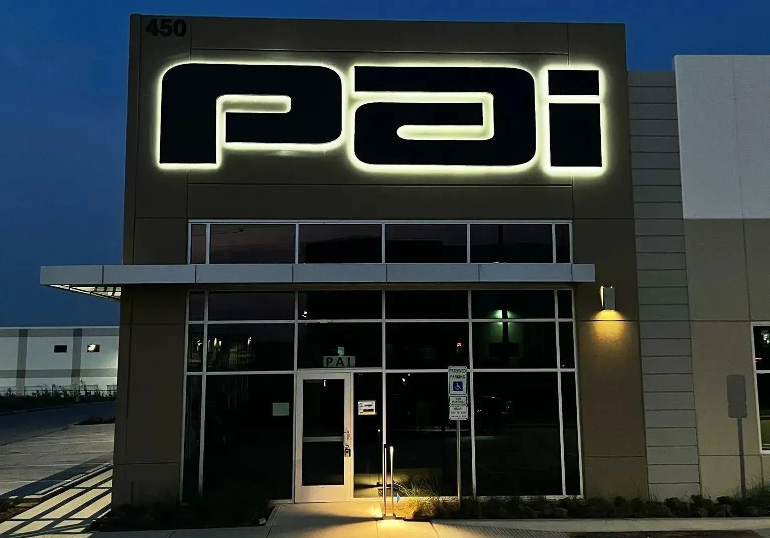 Illuminated 5 foot tall back lit channel letters fabricated and installed for PAI Industries in Flower Mound, TX
