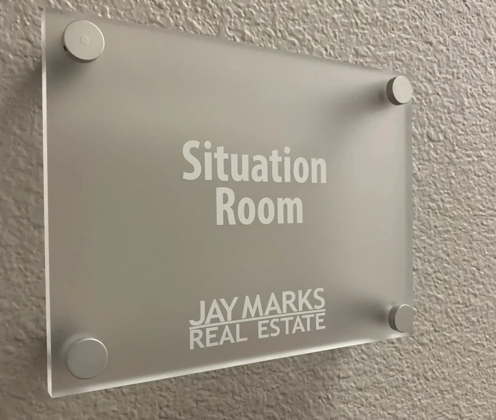 a sign on a wall that says situation room