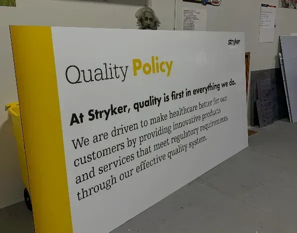 a sign that says quality policy at stryker