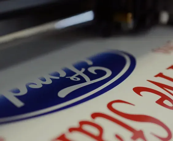 a ford logo is being printed on a piece of paper