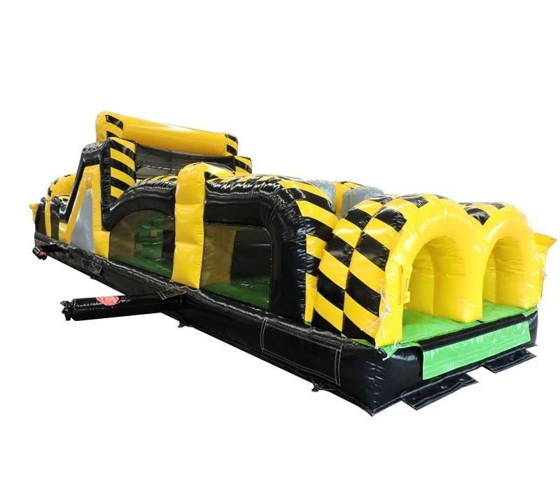 Inflatable yellow and black obstacle course with tunnels and climbing structures.