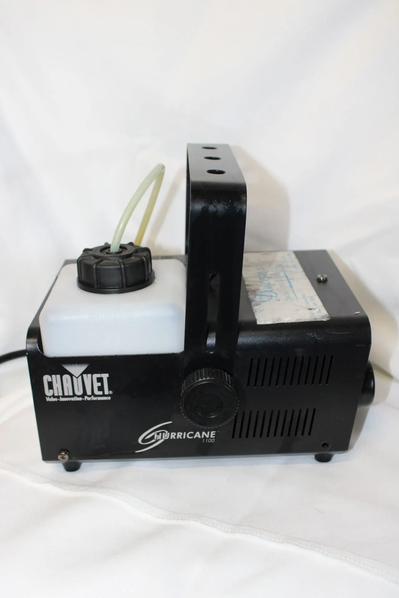 Black Chauvet fog machine with fluid tank and handle.