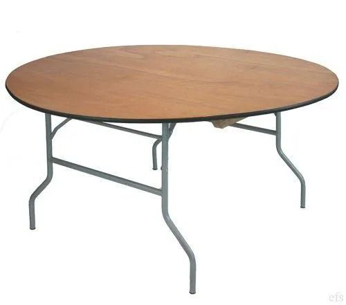 Round wooden folding table with gray metal legs.