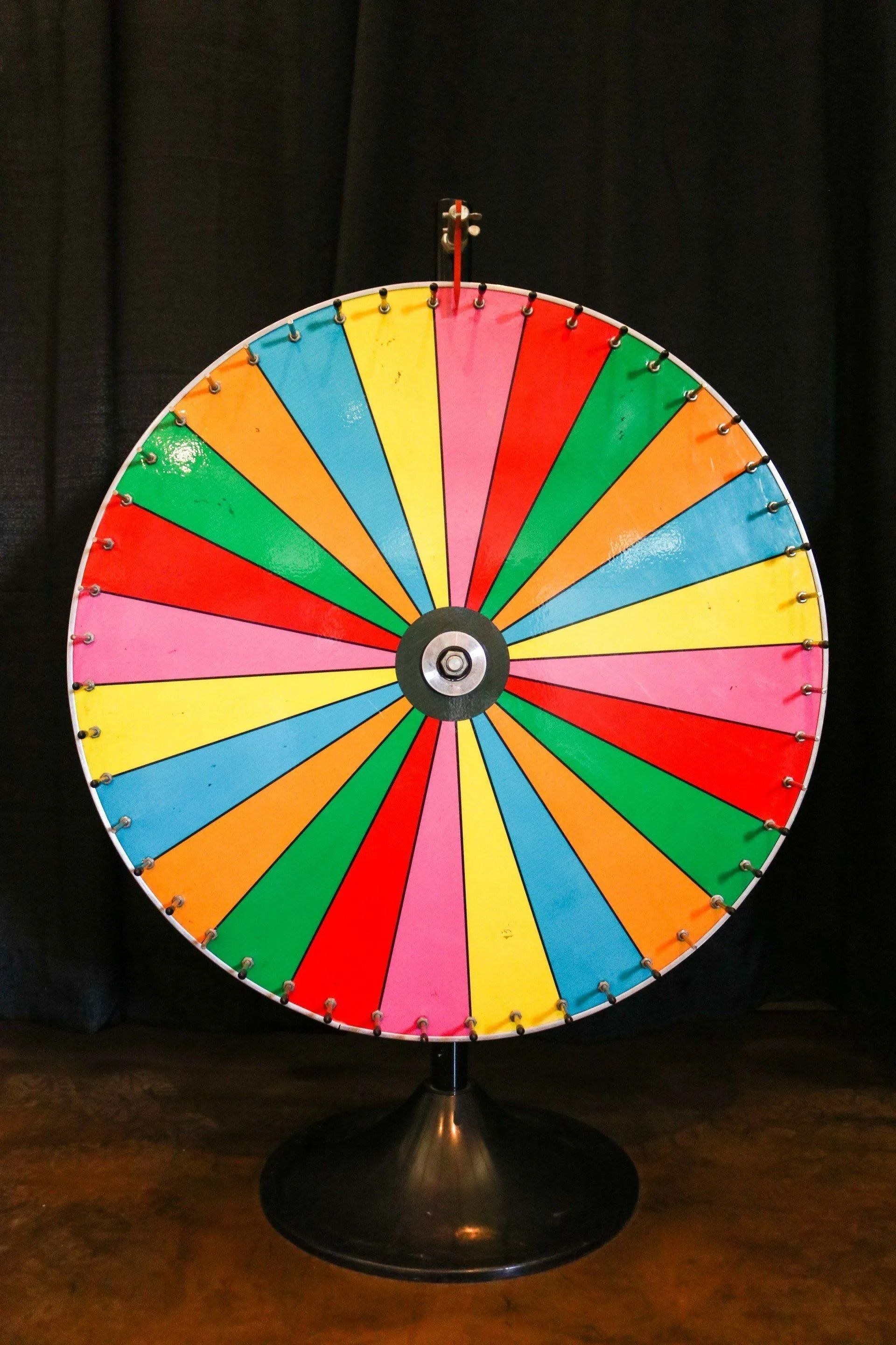 Spinning prize wheel with colorful sections.
