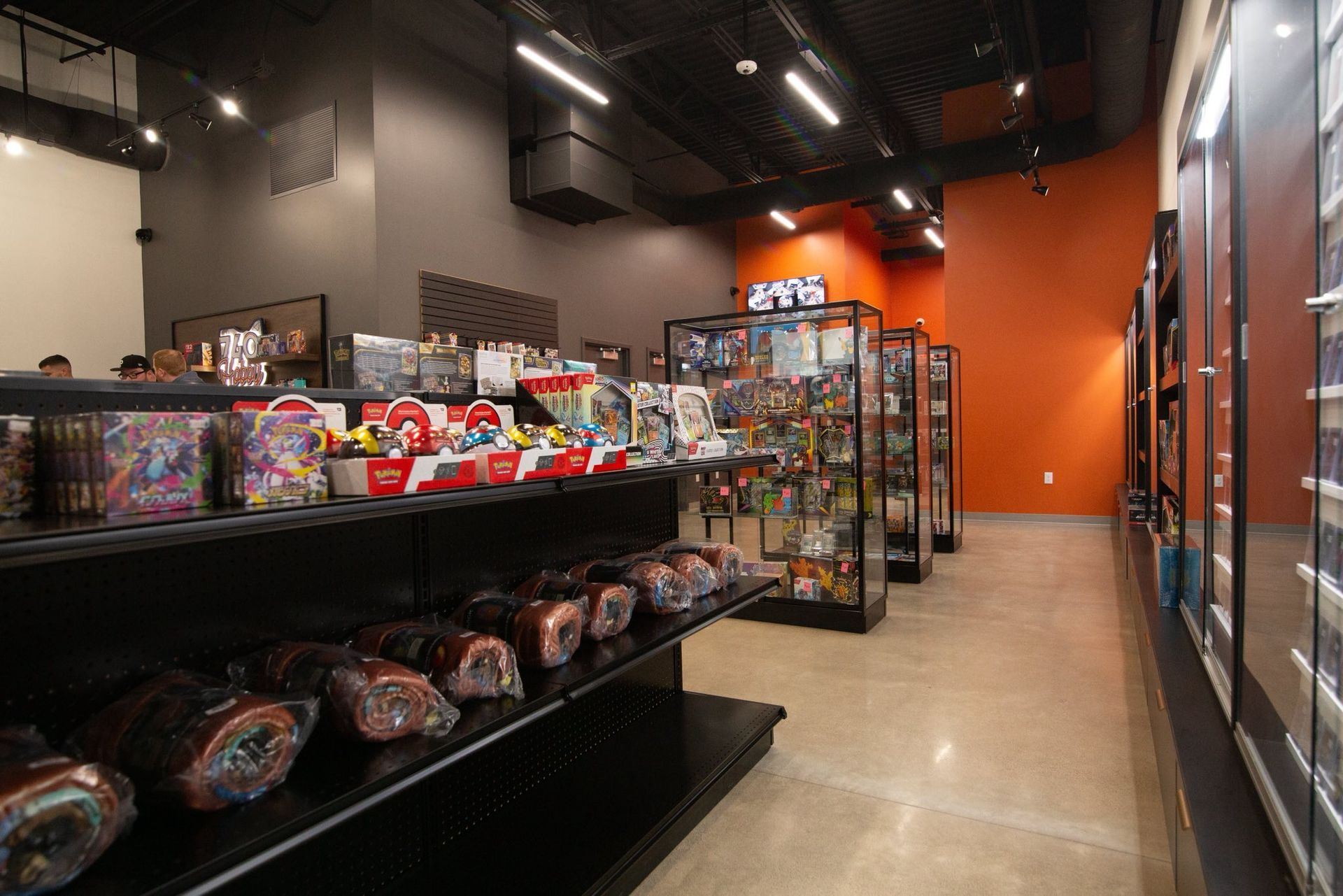 Candy aisle in a brightly lit store with shelves of snacks and colorful displays