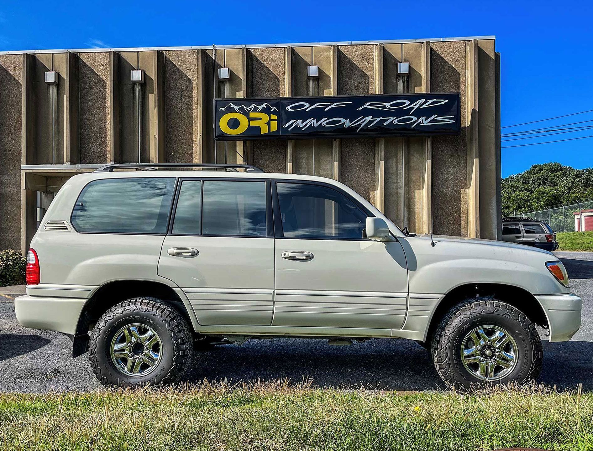 SUV parked by the company sign