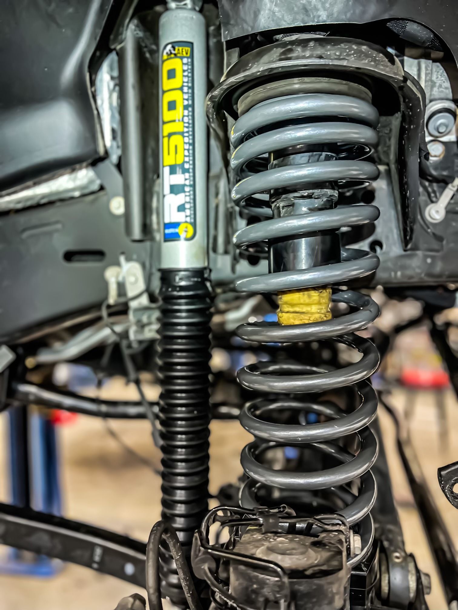 a close-up of a shock absorber on a truck