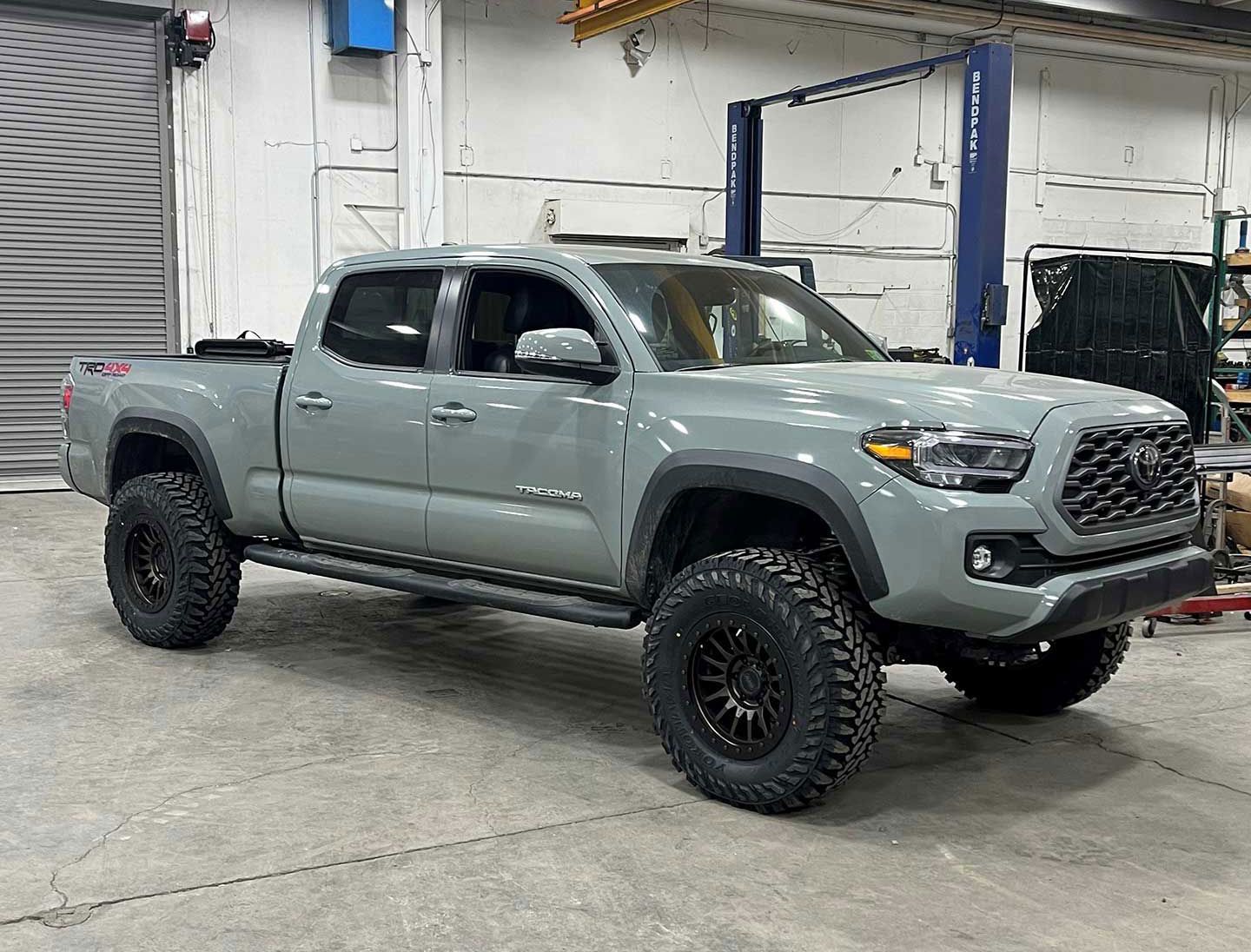 off-white pickup truck in the garage