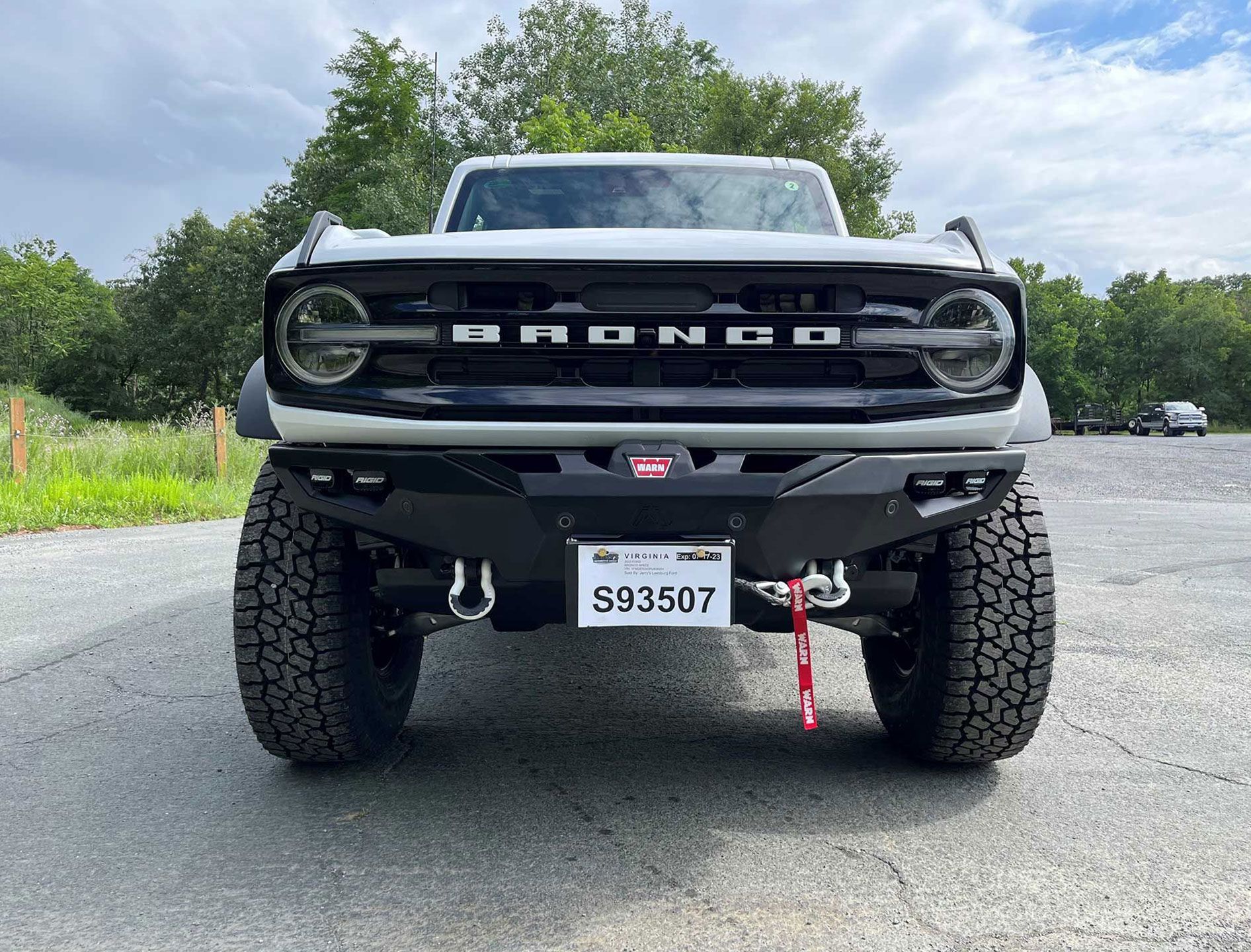 front of white Bronco