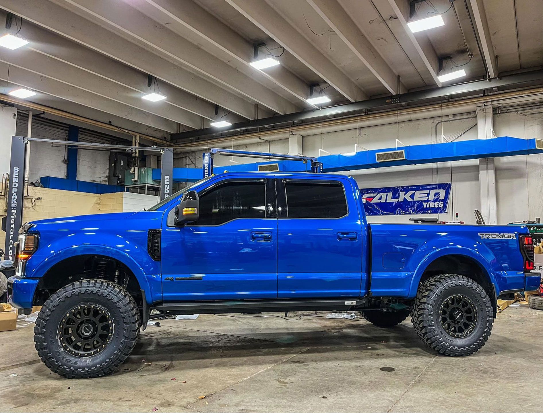 blue pickup truck in the garage
