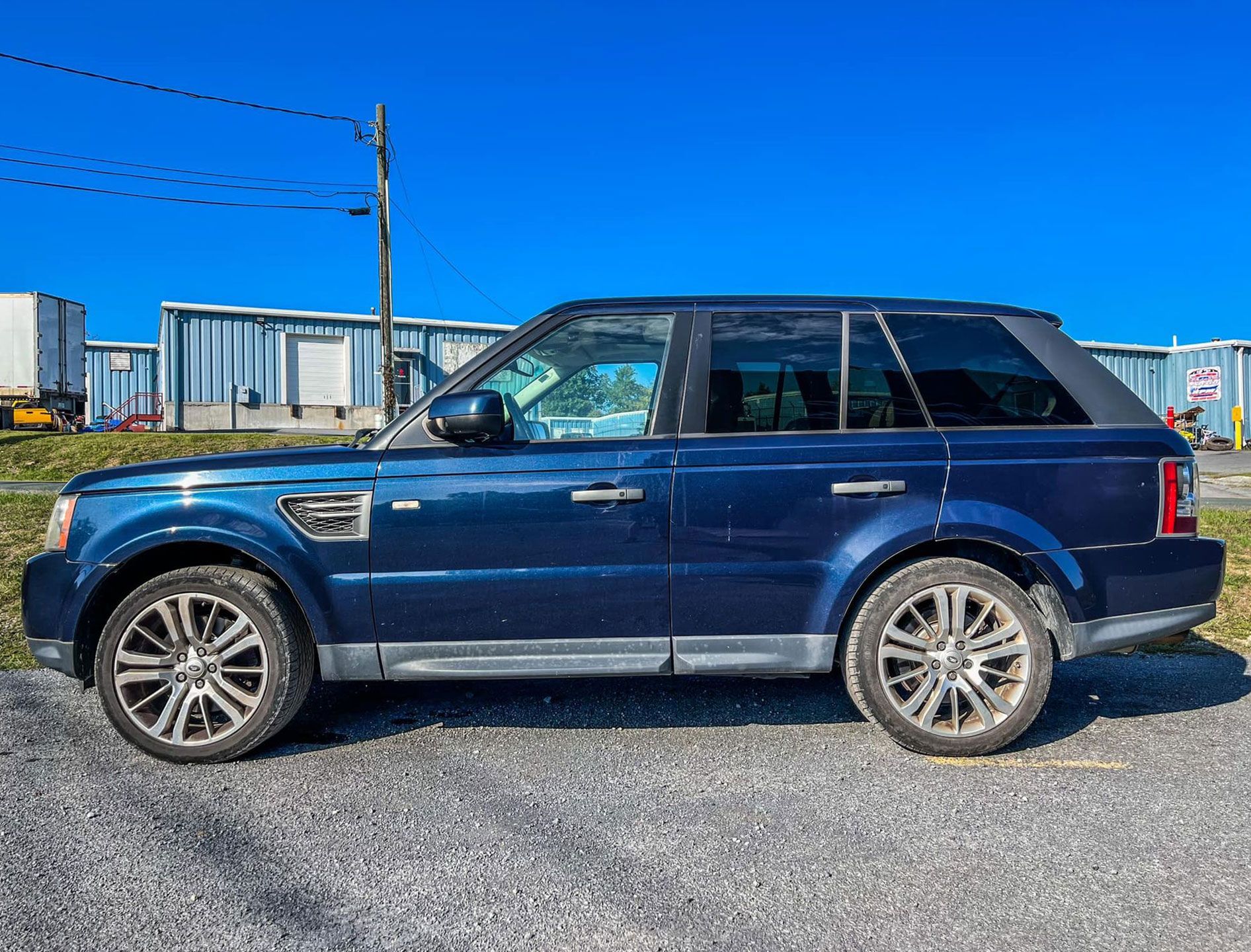 blue car outside garage