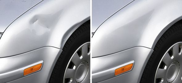 Close-up of a silver car&rsquo;s front fender and wheel with an orange side marker light