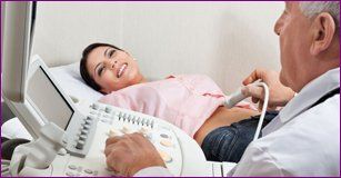 Woman getting checkup for pregnancy