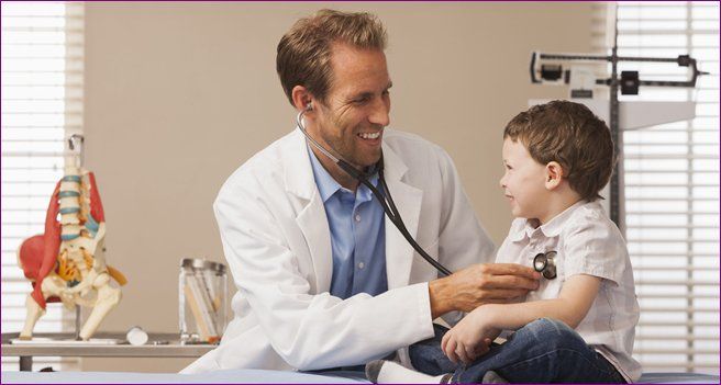 Doctor checking a childern