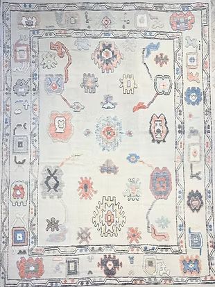 A white rug with a floral pattern on it.