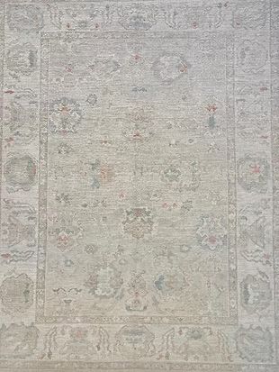 A close up of a rug with a floral pattern on it.