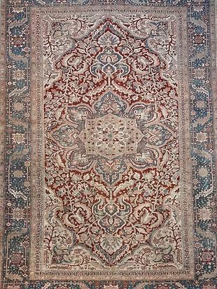 A close up of a rug with a pattern on it.