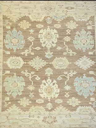 A rug with a floral pattern on it is on a table.