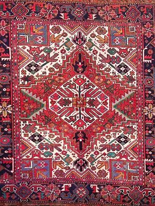 A close up of a rug with a geometric pattern on it.