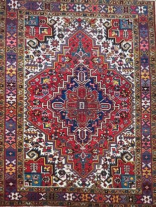 A close up of a colorful rug with a pattern on it.