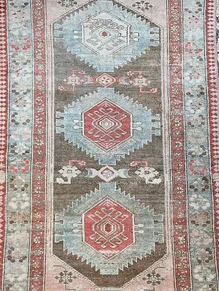 A close up of a rug with a pattern on it.