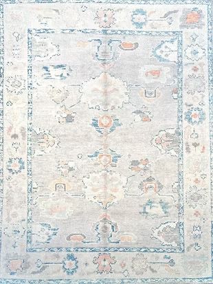 A close up of a rug with a floral pattern on it.