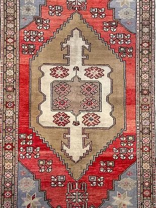 A close up of a rug with a geometric pattern on it.