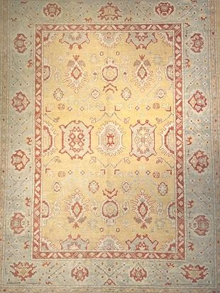 A rug with a floral pattern on it is sitting on a table.