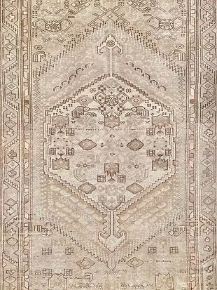 A close up of a rug with a pattern on it.