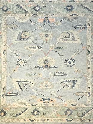 A close up of a rug with a pattern on it.