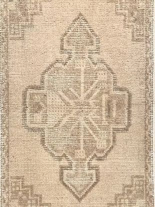 A close up of a rug with a pattern on it.