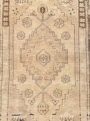 A close up of a rug with a pattern on it.