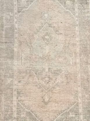 A close up of a rug with a pattern on it.