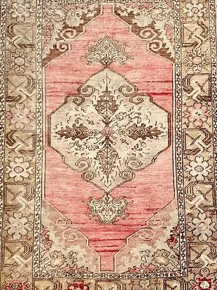 A close up of a rug with a pattern on it.