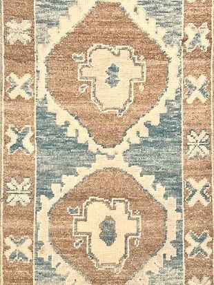 A close up of a rug with a pattern on it.